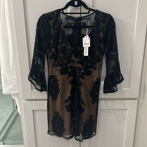 NWT for Love and Lemons gorgeous black dress with sheer and lace design